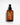 Bernsteinfarbene Flasche mit schwarzer Pumpe, beschriftet mit „Farm Loves Face AHA/PHA + Bio-Aloe Vera Reinigungsgel“, aufrecht auf einer weißen Oberfläche, dahinter leichter Schatten.