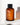 Eine braune Flasche "Veganes Kollagen + Bio-Hafer Barriere & Hydro Toner" von Farm Loves Face-ein Gesichtstoner, der die Hautbarriere stärkt-steht auf weißem Untergrund. Gratis Socken inklusive.