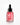 Auf einem weißen Hintergrund steht eine Tropfflasche aus klarem Glas, gefüllt mit rosa Serum und der Aufschrift „Farm Loves Face Panthenol + Bio-Kastanie Calming Serum“ – perfekt für empfindliche Haut.