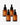 Vier bernsteinfarbene Tropfflaschen mit Farm Loves Face Vitamin C + Bio-Sanddorn Glow Serum, jede mit einem minimalistischen orangefarbenen Entenlogo, sind auf einem weißen Hintergrund angeordnet.