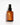 Eine braune Glasflasche mit einer schwarzen Pumpe und der Aufschrift „Farm Loves Face Ceramide + Bio-Chicoree Barriere Hydro Creme“ steht auf einer weißen Oberfläche, perfekt zum Schutz der Hautbarriere, vor einem hellen Hintergrund.